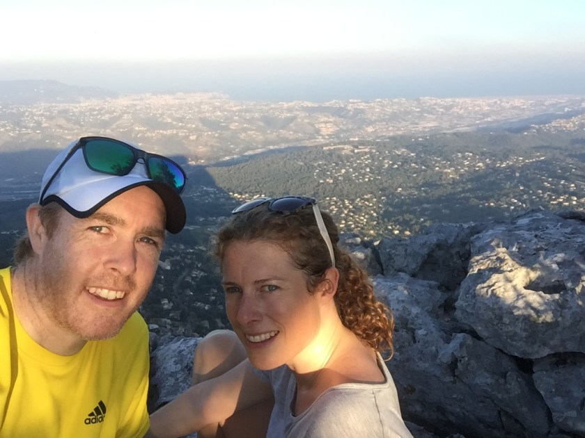 Andy and Lorna at the summit of a mountain overlooking the Var river, hills and villages, down to the sea