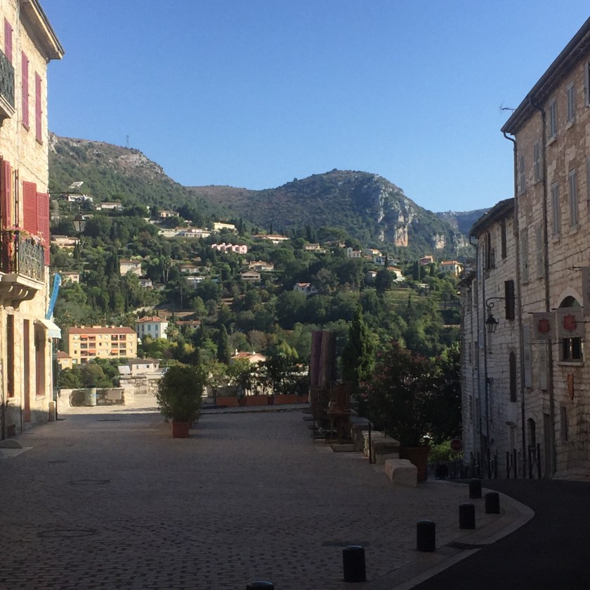 A square in Vence with a view on the mountains above the town