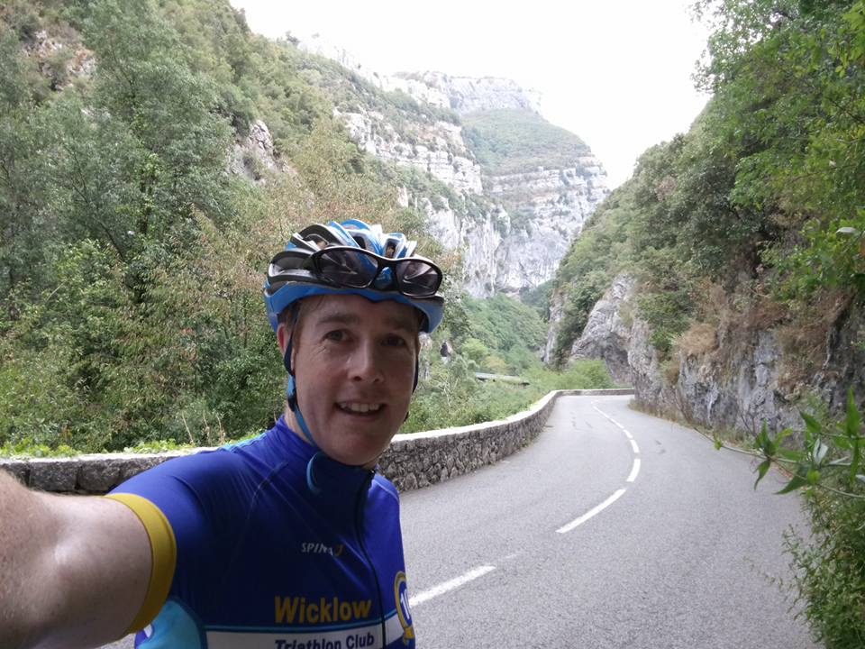 Cyclist selfie on road that goes through the gorge