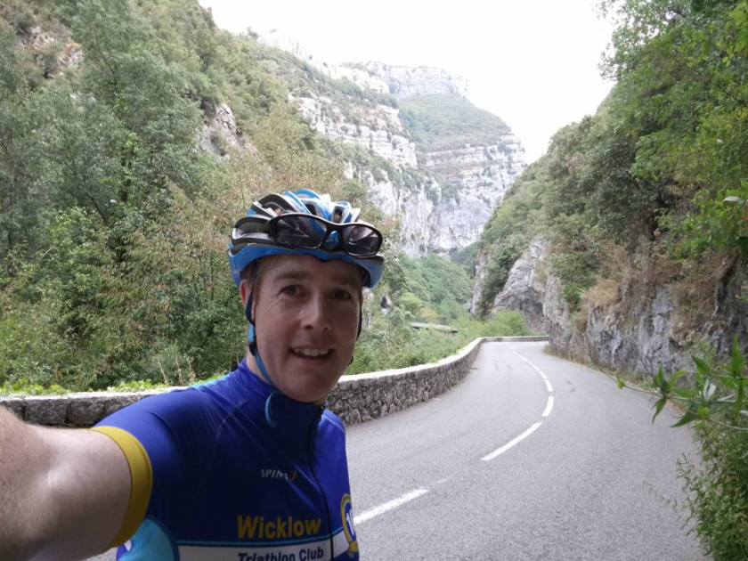 Cyclist selfie on road that goes through the gorge